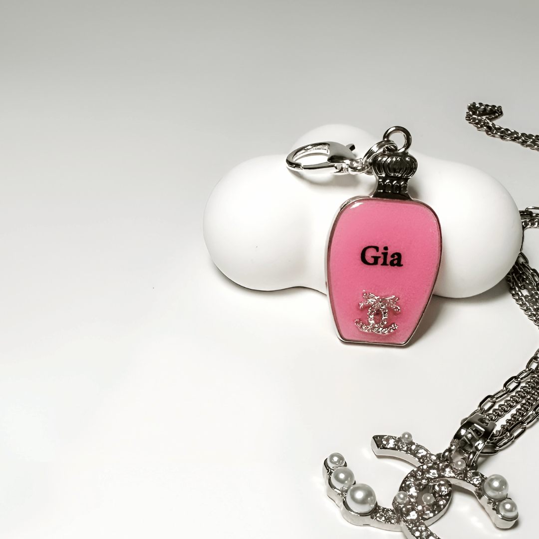 Pink perfume bottle pet ID tag with silver stainless steel hardware and Coco Chanel inspired crystal decoration, pink and silver pet ID tag.