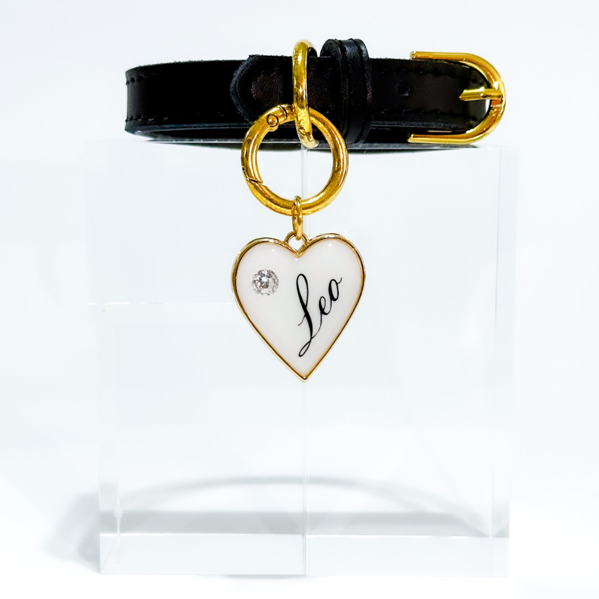 White heart-shaped pet ID tag with gold-plated stainless steel hardware and cubic zirconia crystal.