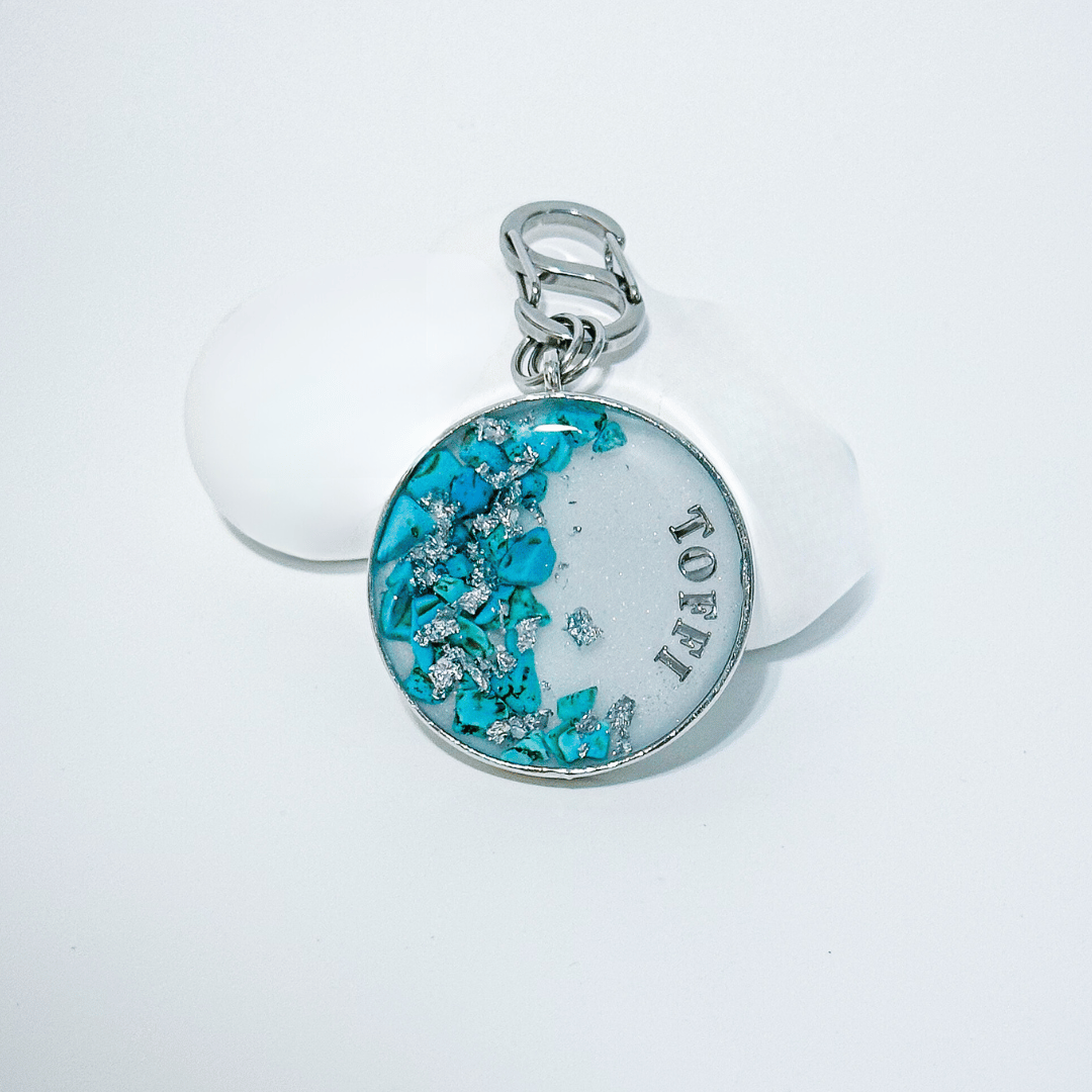 Shimmery white round pet ID tag with silver stainless steel hardware, turquoise blue stones and silver foil.