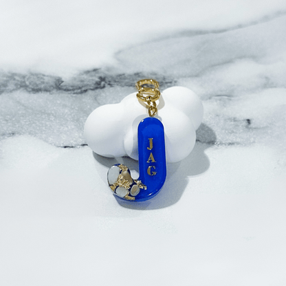 Royal blue letter J personalised initial custom pet ID tag with gold-plated stainless steel hardware, seashells and gold flake.