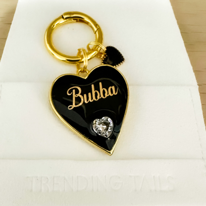 Black heart-shaped pet ID tag with gold-plated stainless steel hardware and heart-shaped cubic zirconia crystal.