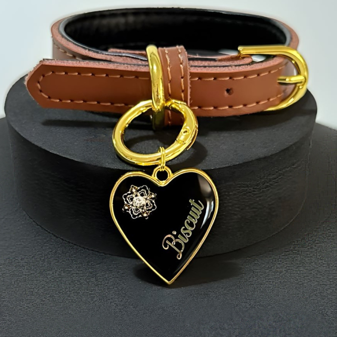 Black heart-shaped pet ID tag with gold-plated stainless steel hardware and Swarovski crystal on gold foil pattern.