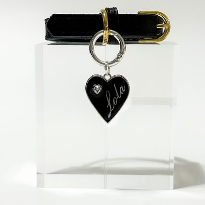 Black heart-shaped pet ID tag with silver stainless steel hardware and heart-shaped cubic zirconia crystal.