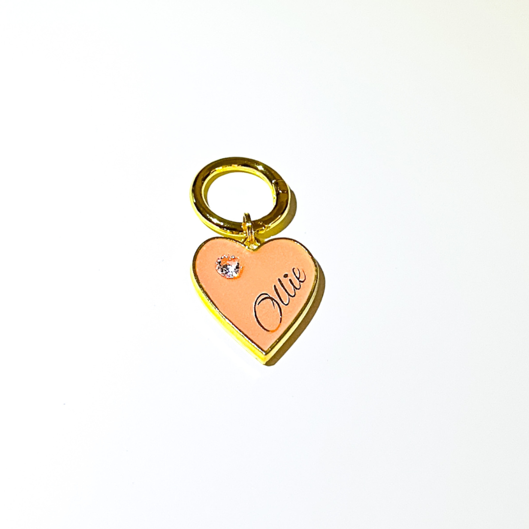 Pastel orange heart-shaped pet ID tag with gold-plated stainless steel hardware and cubic zirconia crystal.