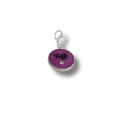 Purple round pet ID tag with silver stainless steel hardware and cubic zirconia crystal.