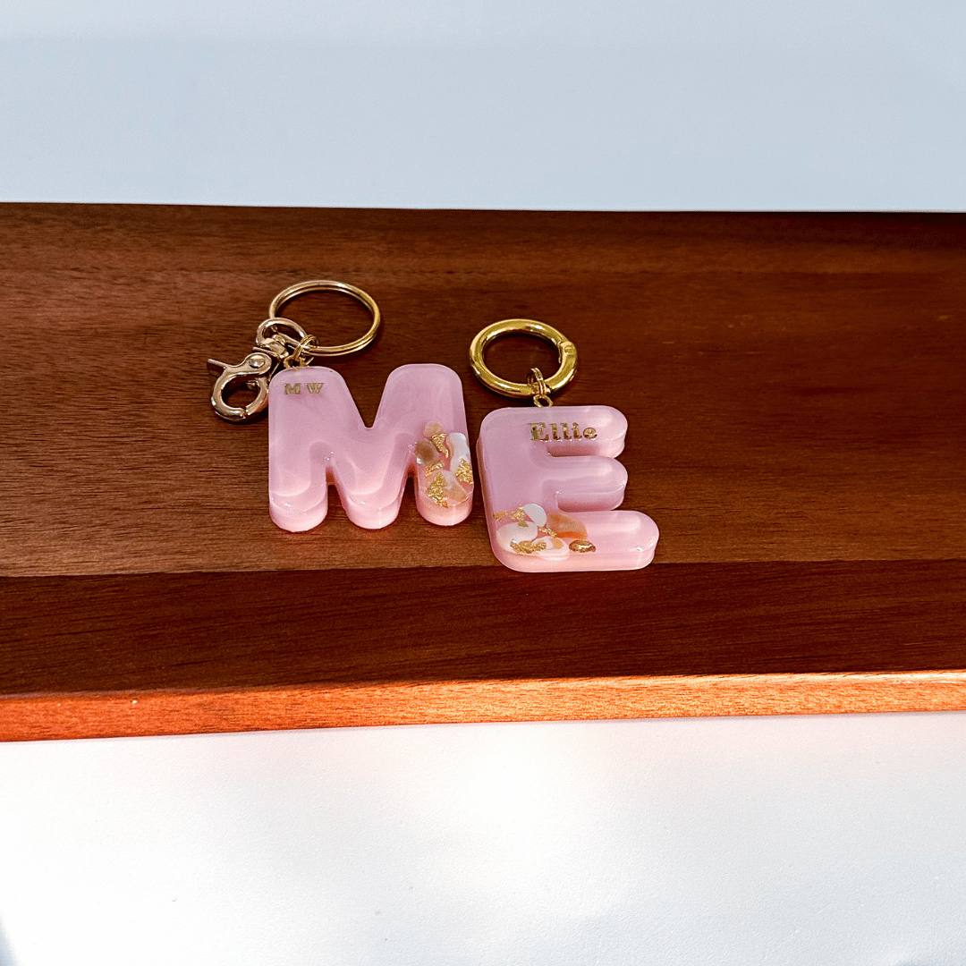 Pink letter M E personalised initial custom pet ID tag with gold-plated stainless steel hardware, seashells and gold flake.