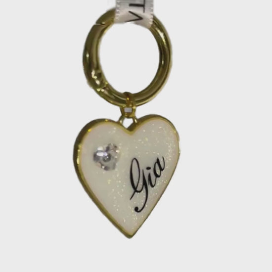 Iridescent shimmery white heart-shaped pet ID tag with gold-plated stainless steel hardware and heart-shaped cubic zirconia crystal.