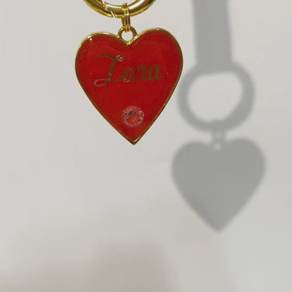 Shimmery watermelon red heart-shaped pet ID tag with gold-plated stainless steel hardware and cubic zirconia crystal, sparkly red and gold pet ID tag.