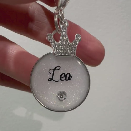 Pearlescent glittery white round pet ID tag with silver stainless steel hardware and cubic zirconia crystal.