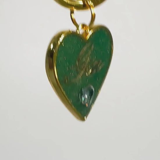 Shimmery green heart-shaped pet ID tag with gold-plated stainless steel hardware and heart-shaped cubic zirconia crystal, sparkly emerald green and gold pet ID tag.